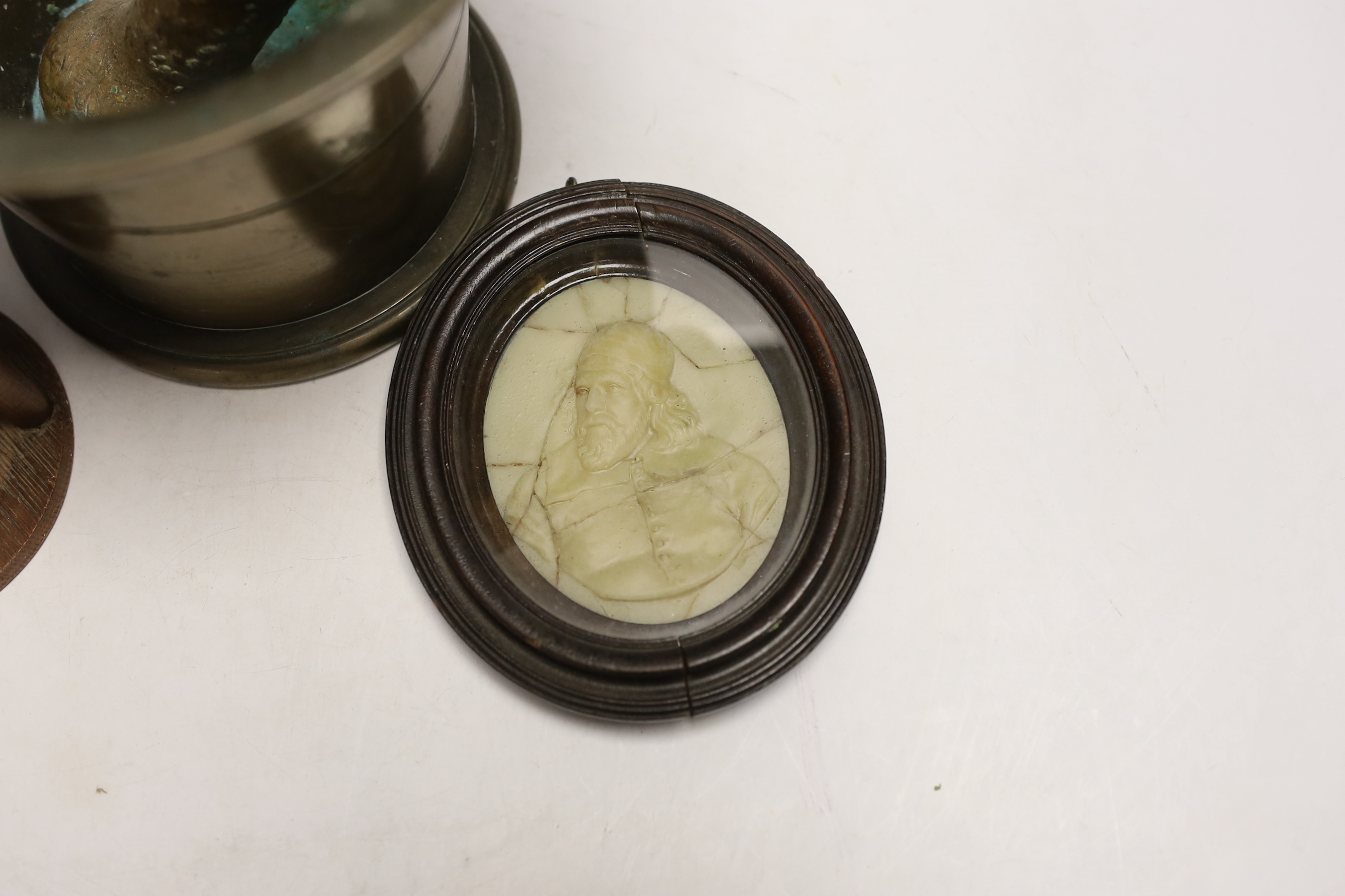 A bronze pestle and mortar, an hourglass and a wax portrait of Inigo Jones, mortar 15cm high